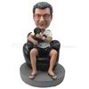 Custom man bobbleheads  sitting on sofa holding a puppy