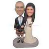 Wedding cake topper groom wearing Scottish kilt bride in white dress