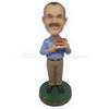 Custom bobblehead man in casual wear with hot dogs in hand