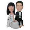 Bride and groom sitting together custom bobbleheads