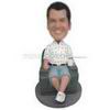 Free man sitting on the sofa holding a cup custom bobbleheads