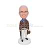 Personalized handmade businessman bobble head with a brown hat on hand