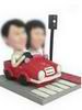 Couple bobblehead in red car