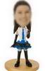 Female bobbel head doll wearing school uniforms