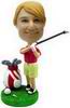 A bobblehead Wearing a red sweat-shirt in golf