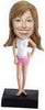 Female bobble head doll wearing slippers