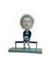 Female bobble head doll on the bench