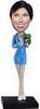 Female bobble head doll with  blue clothes