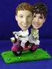 Groom and bride bobblehead riding a motorcycle