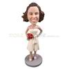 The bride holds a bouquet of flowers custom bobbleheads