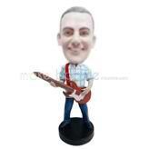 homme professionnel sur mesure et guitare figurines