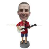 homme professionnel sur mesure et guitare figurines