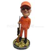 Custom man and gun bobblehead doll