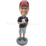 Custom man bobbleheads  in a baseball cap with cellphone