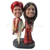Wedding bobbleheads couple in traditional clothes