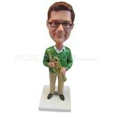 Custom musician in sweater and khaki pant with trumpet bobbleheads