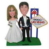 Groom in black suit and groom in wedding dress in les vegas custom bobbleheads