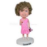 Curly hair little girl holding baby's bottle custom bobbleheads