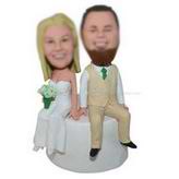 Groom in green tie and the bride in wedding dress sitting together custom bobbleheads