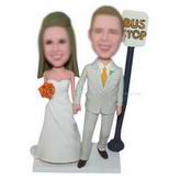 Groom in beige suit and bride in white wedding dress at the bus stop custom bobbleheads