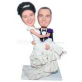 Groom in black suit holding his bride in white wedding dress custom bobbleheads