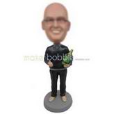 Smiling man in black T-shirt handing up with a bottle custom bobbleheads