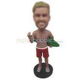 Strong man in red shorts handing up with a surfboard custom bobbleheads