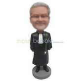 Man in black overcoat handing up with a bag custom bobbleheads