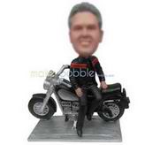 Cool man in black jacket with his motorcycle custom bobbleheads