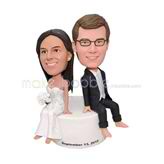 Customized wedding bobblehead sitting on the base 