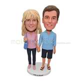 Couple bobble head doll with blue bag