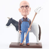 Man in blue cloth overall bobblehead with the cow