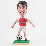 Soccer player bobblehead in red cloth