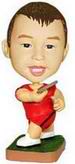 Boy bobble head doll