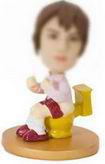 Female bobble head doll  with  toilet