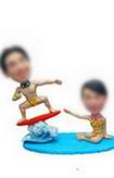 Beach couple bobble head doll