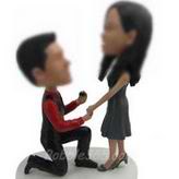 Personalized bobbleheads of marriage proposal