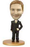 Male bobble head doll in black suit