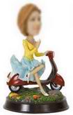 Female bobble head doll with  red motorcycle