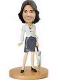 Working Girl bobblehead holding an umbrella