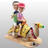 Camel ride bobble head doll