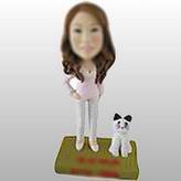 Casual lady bobble head doll with a dog