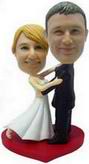 The bride and groom dancing bobble head doll