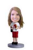 Female bobble head doll holding roses