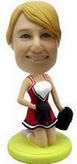 Red cheerleader bobble head doll