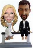 Bride and groom  bobblehead sat on the chair