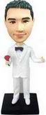 The groom bobblehead  - a white tuxedo