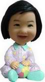 Happy little girl bobble head doll