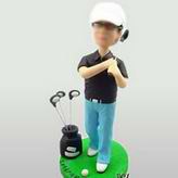 Young golf player bobble head doll