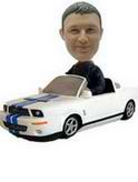 A man bobblehead with a white car